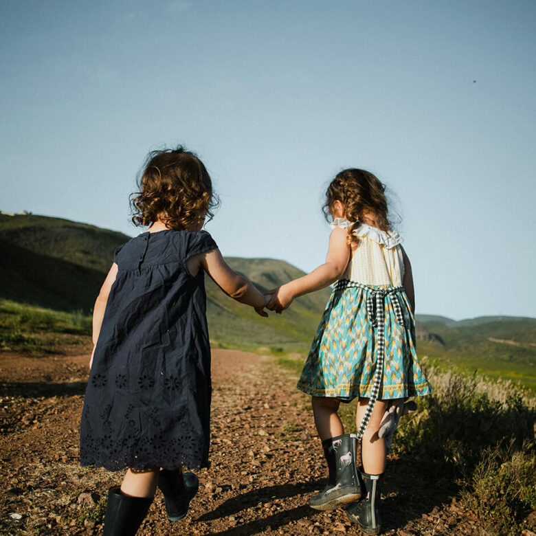 Children walking and holding hands