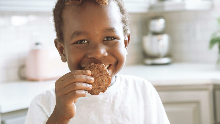 Smiling child eating food